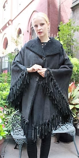 Marc Kaufman Furs Presents a charcoal gray shearling cape from Marc Kaufman Furs New York,Argentina,United Kingdom,Austria,Denmark,Norway,Australia,Finland,Saudi Arabia,Oman,Kuwait,Jordan,Egypt