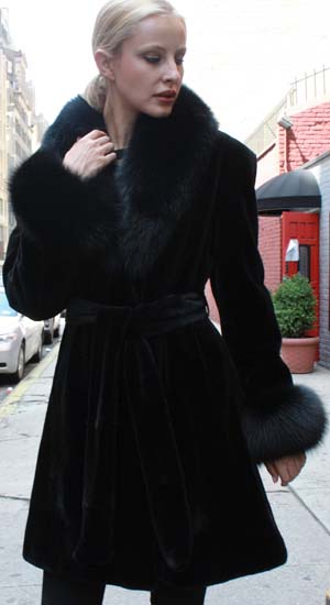 Marc Kaufman Furs Presents a black sheared mink fur stroller with black fox collar cuffs and belt from Marc Kaufman Furs New York,Argentina,United Kingdom,Austria,Denmark,Norway,Australia,Finland,Saudi Arabia,Oman,Kuwait,Jordan,Egypt