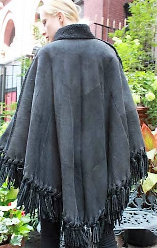 Marc Kaufman Furs Presents a charcoal gray shearling cape from Marc Kaufman Furs New York,Argentina,United Kingdom,Austria,Denmark,Norway,Australia,Finland,Saudi Arabia,Oman,Kuwait,Jordan,Egypt