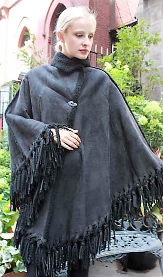 Marc Kaufman Furs Presents a charcoal gray shearling cape from Marc Kaufman Furs New York,Argentina,United Kingdom,Austria,Denmark,Norway,Australia,Finland,Saudi Arabia,Oman,Kuwait,Jordan,Egypt