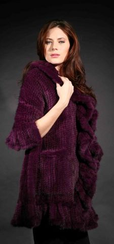 Marc Kaufman Furs Presents a purple knit mink fur cape with ruffled border from Marc Kaufman Furs New York,Argentina,United Kingdom,Austria,Denmark,Norway,Australia,Finland,Saudi Arabia,Oman,Kuwait,Jordan,Egypt