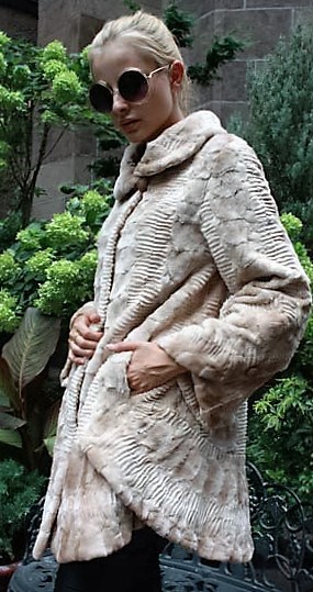 Marc Kaufman Furs Presents a ivory lazer cut sheared mink stroller from Marc Kaufman Furs New York,Argentina,United Kingdom,Austria,Denmark,Norway,Australia,Finland,Saudi Arabia,Oman,Kuwait,Jordan,Egypt