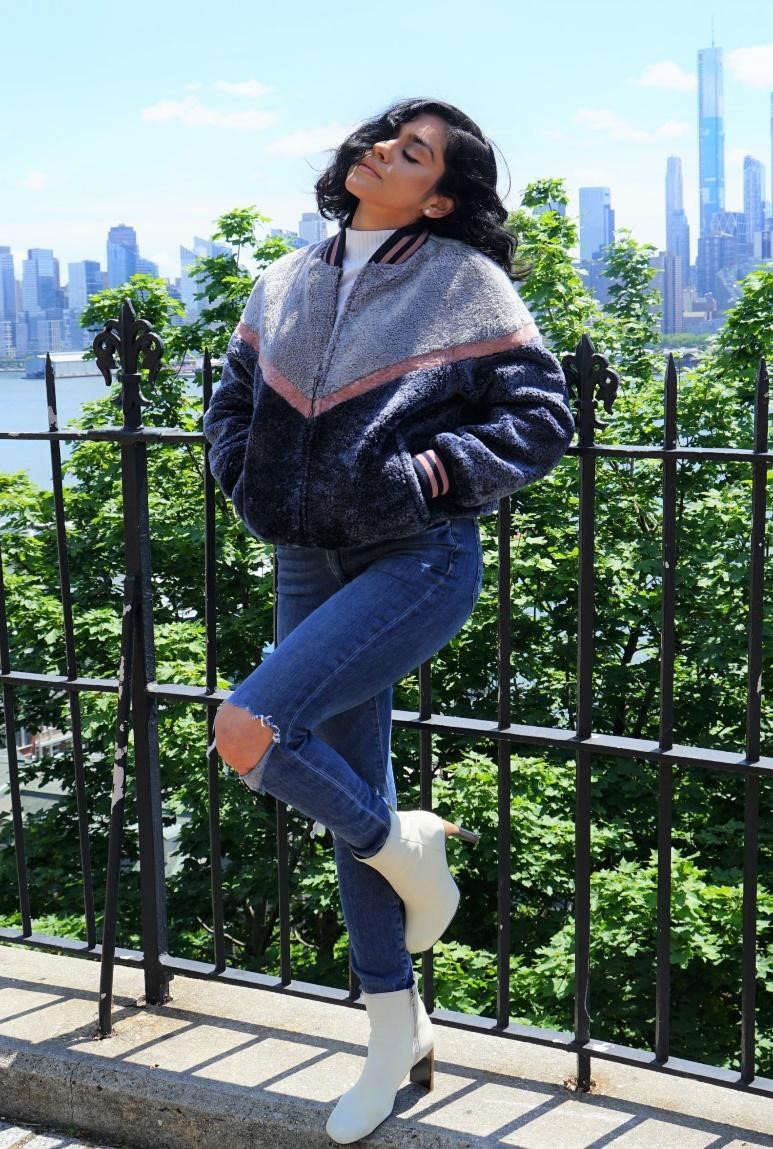 A woman wearing a shearling jacket